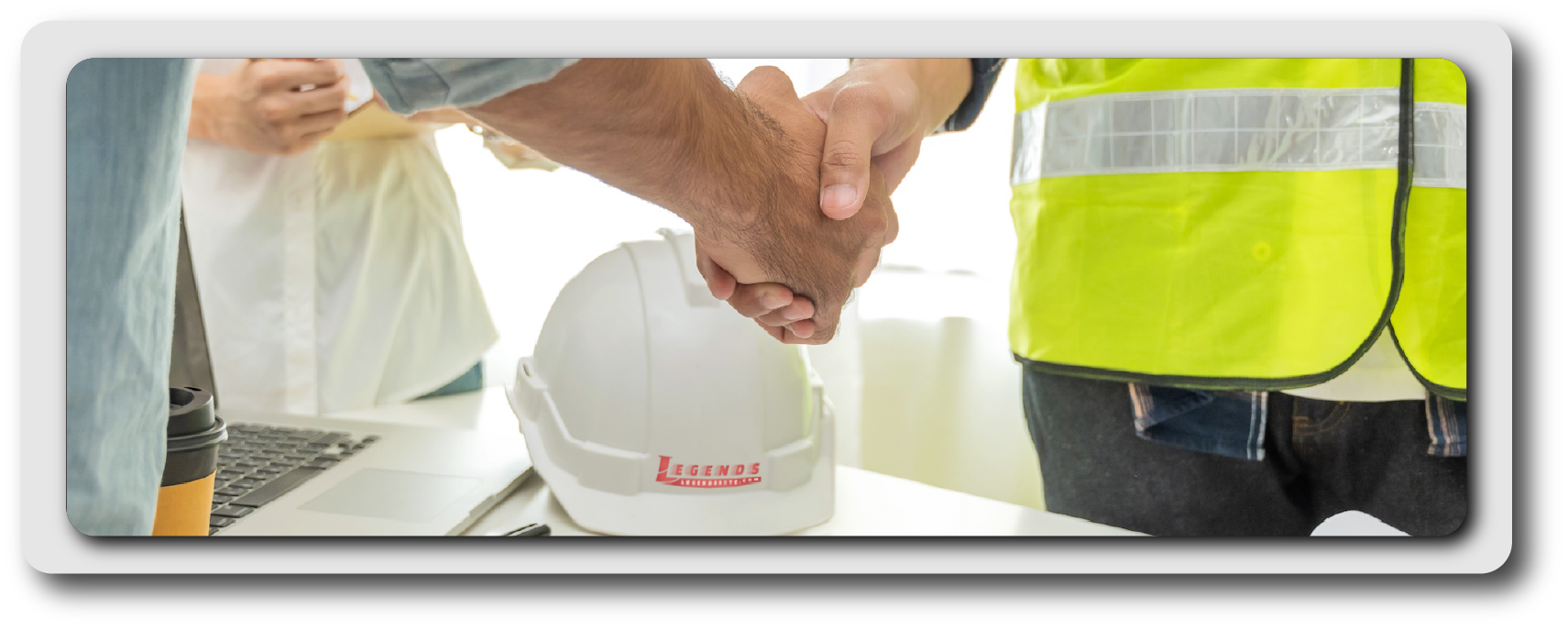 Handshake with hardhat and plans
